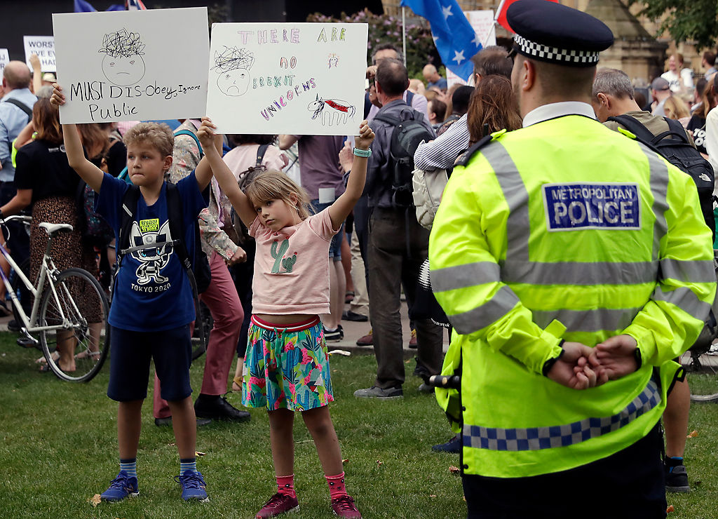 Anti-Brexit supporters take part in a protest at College Green near the Houses of Parliament in central London
